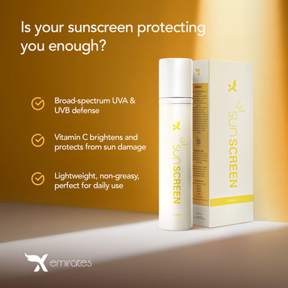 Sunscreen bottle and packaging with product features on a warm gradient background, Emirates logo visible.
